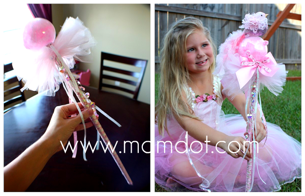 A girl with a fairy wand made with tulle and korker ribbons made at home with this tutorial.
