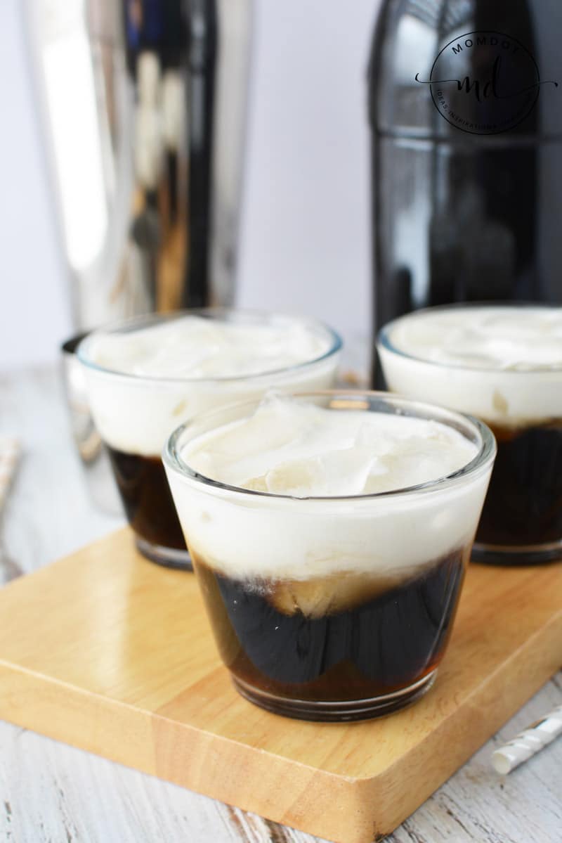 Homemade Kahlua with cream and ice cubes