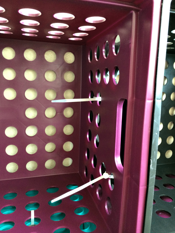Create easy and inexpensive kid friendly cubby holes with $3 baskets and zip ties
