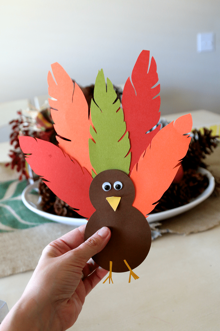 Finished paper turkey craft can be used to make a turkey hat, turkey headband, or turkey centerpiece
