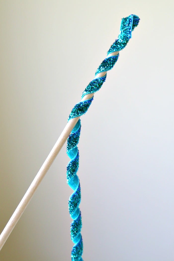 A finished korker ribbon that is tightly spiraled and ready for making hair ribbons or other crafts.