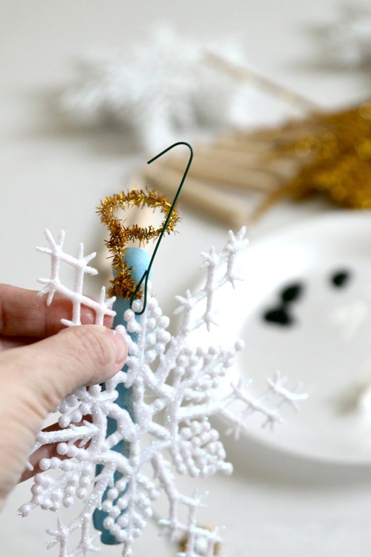 Beautiful Clothespin Angel Ornaments, great for a tree full of angels, to pass out as gifts, and to add on the top of presents for something special. Takes mere minutes to make