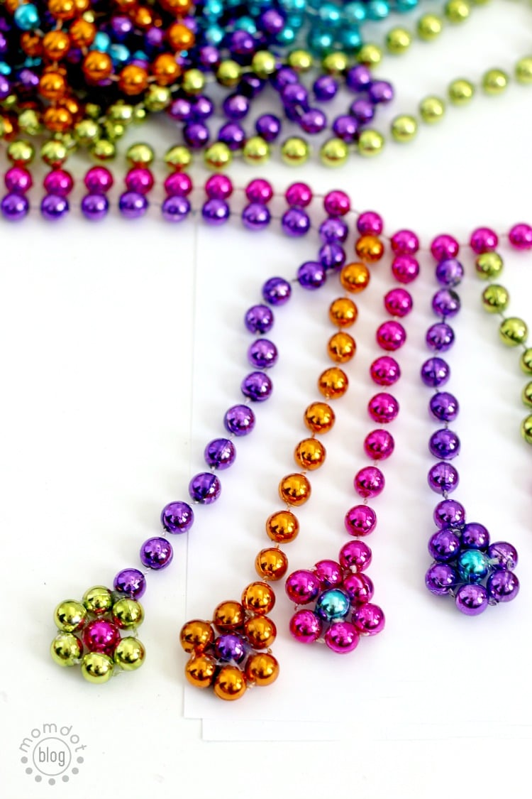 DIY Mardi Gras Flower Necklace: Repurpose your Mardi Gras beads into a statement necklace