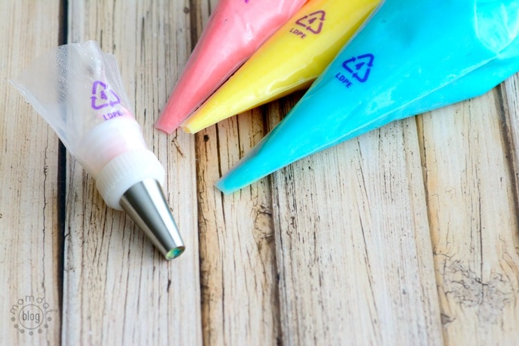 Unicorn Poop Cupcake Cones - learn how to make rainbow cupcake cones perfect for school parties. SO FUN. Get recipe and how to swirl frosting here now!