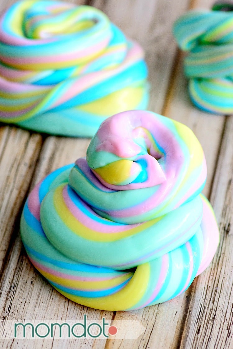 Pastel unicorn slime piled on a table to look like a pile of unicorn poop.