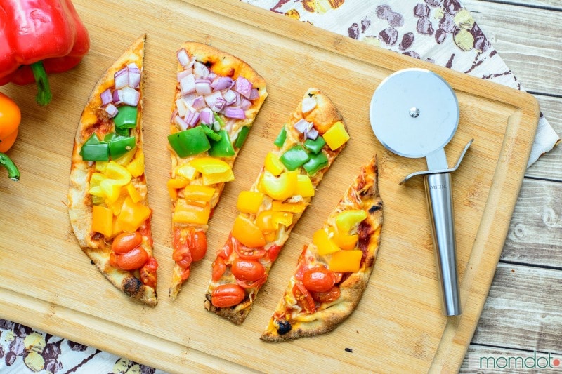 Rainbow Veggie Pizza Recipe - Grab this simple homemade flatbread pizza and thrill your family with a FUN and healthy way to eat dinner! No leftovers here...totally kid friendly.