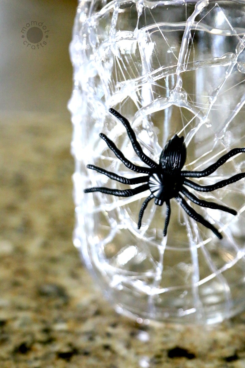 Spider jar complete with hot glue web and a big fake spider in the middle