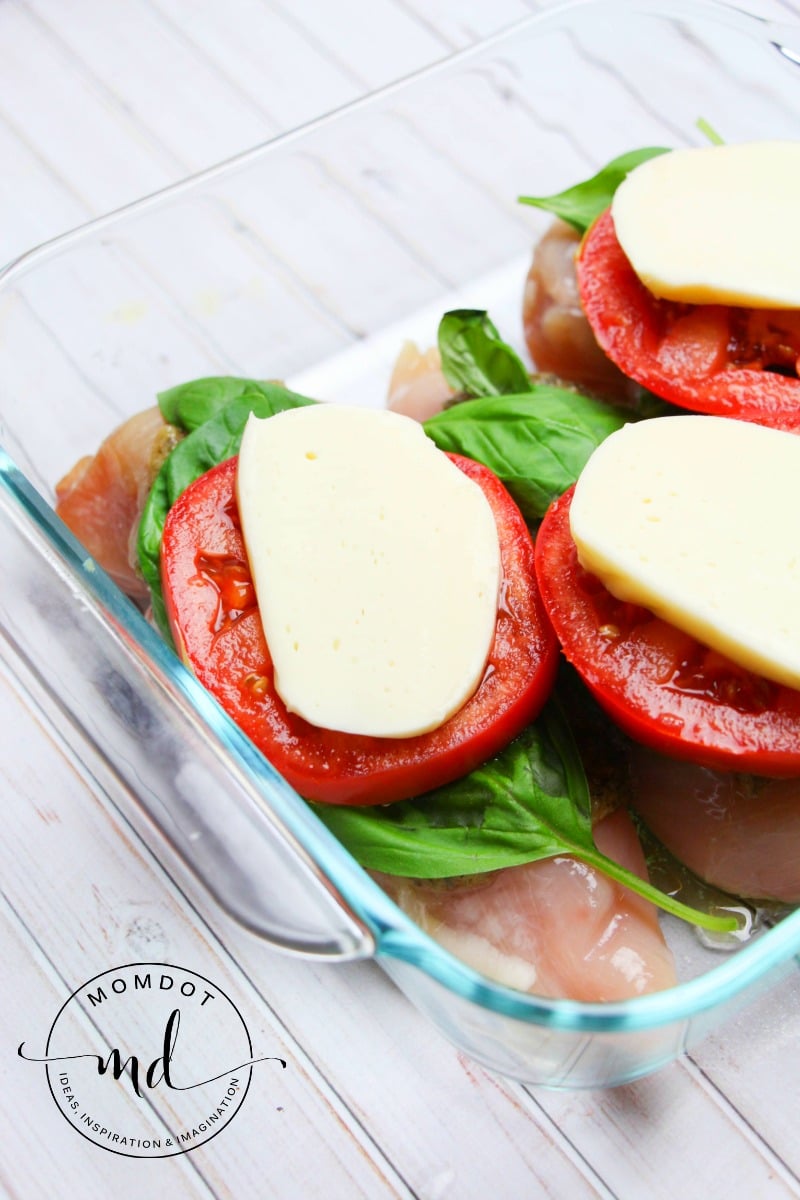 Baked Caprese Pesto Chicken in a baking dish, 21 Day Fix Friendly, Keto Friendly, Clean Eating Recipe