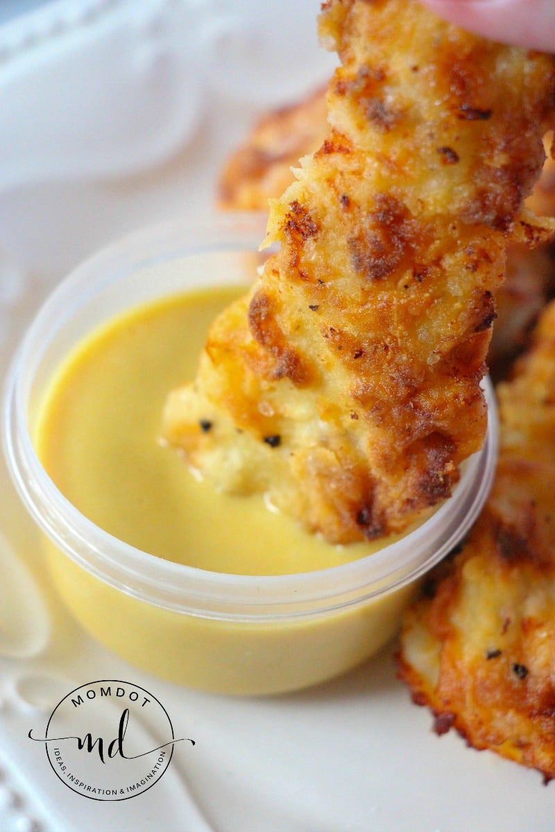 Copycat Chick-Fil-A Chicken Tenders dipped in a creamy honey mustard sauce