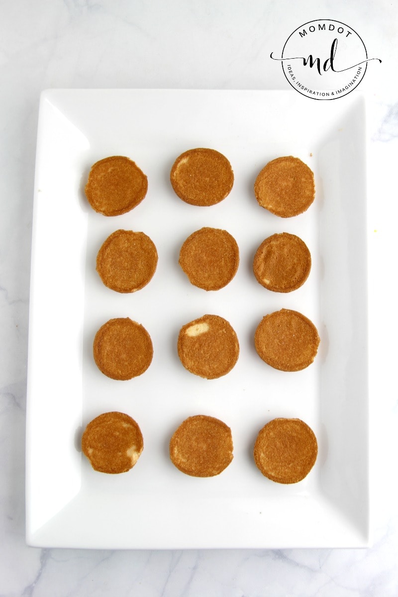 Nilla wafers on a white plate that are the base for clam shell cookies