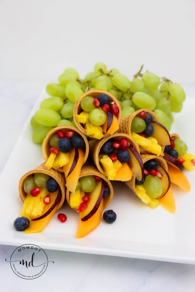 Cornucopia Centerpiece | Fruit Cornucopia with Sugar Cones | Kid Friendly Thanksgiving Idea #tutorial #recipe #thanksgivingrecipes #fruitideas #cornucopia #kidfriendly #crafting #holidays #fall