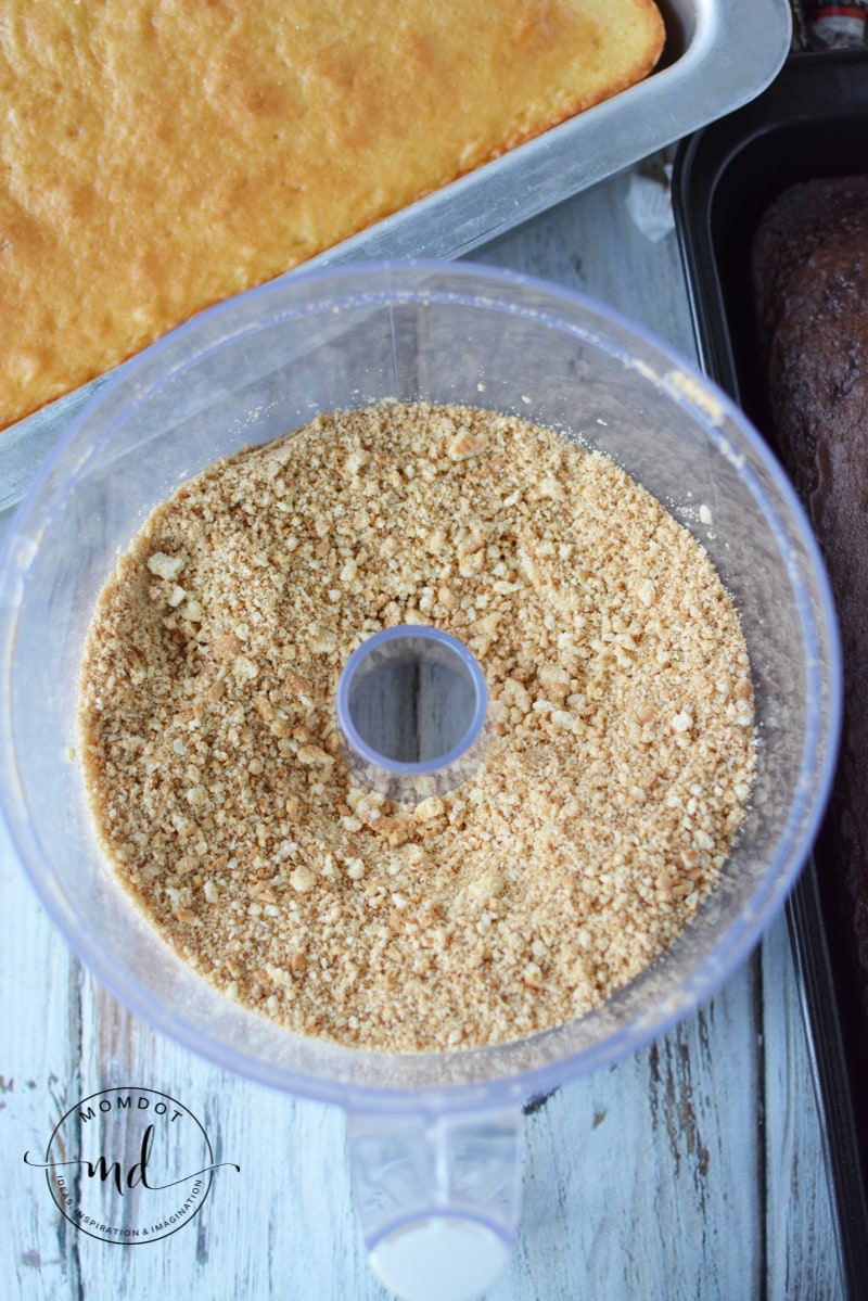 Vanilla sandwich cookies in a food processor make the fake kitty litter for the top of the cat litter cake.