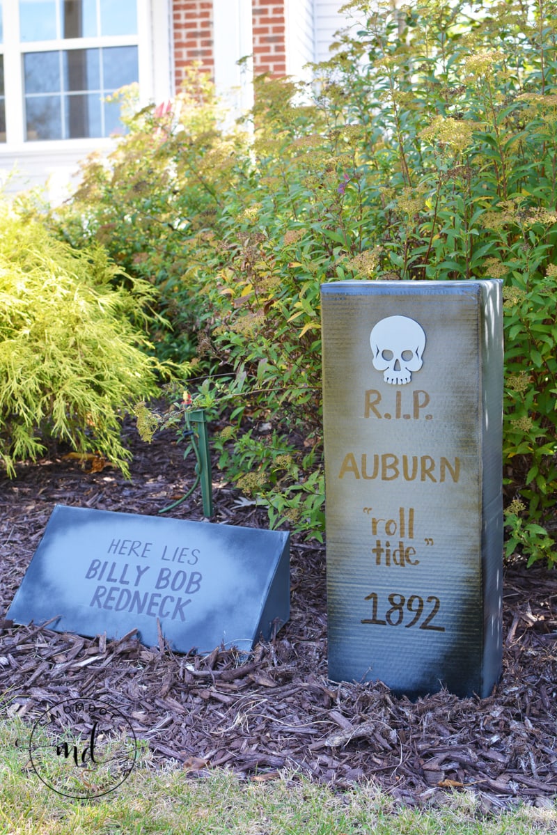 Funny cardboard tombstones in a yard for Halloween decor