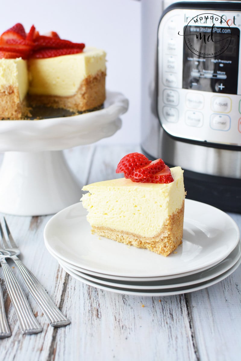 Instant Pot classic cheesecake with sliced fresh strawberries on top. The texture is perfect.