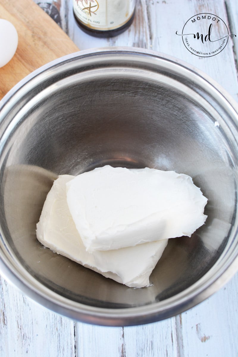 cream cheese in a mixing bowl to make Instant Pot cheesecake