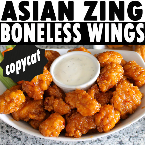 Asian Zing Boneless Wings copycat recipe chicken bites in a bowl with ranch dressing and celery.