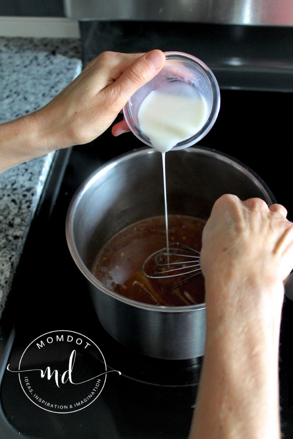 Cornstarch and water mixture being added to Asian Zing wing sauce so it will thicken.
