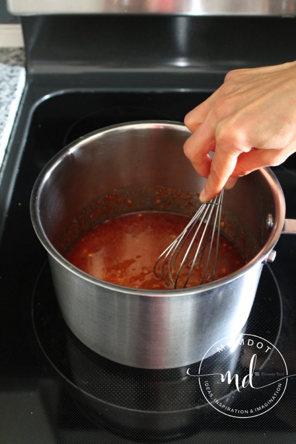 Asian Zing wing sauce ingredients incorporated by a whisk.