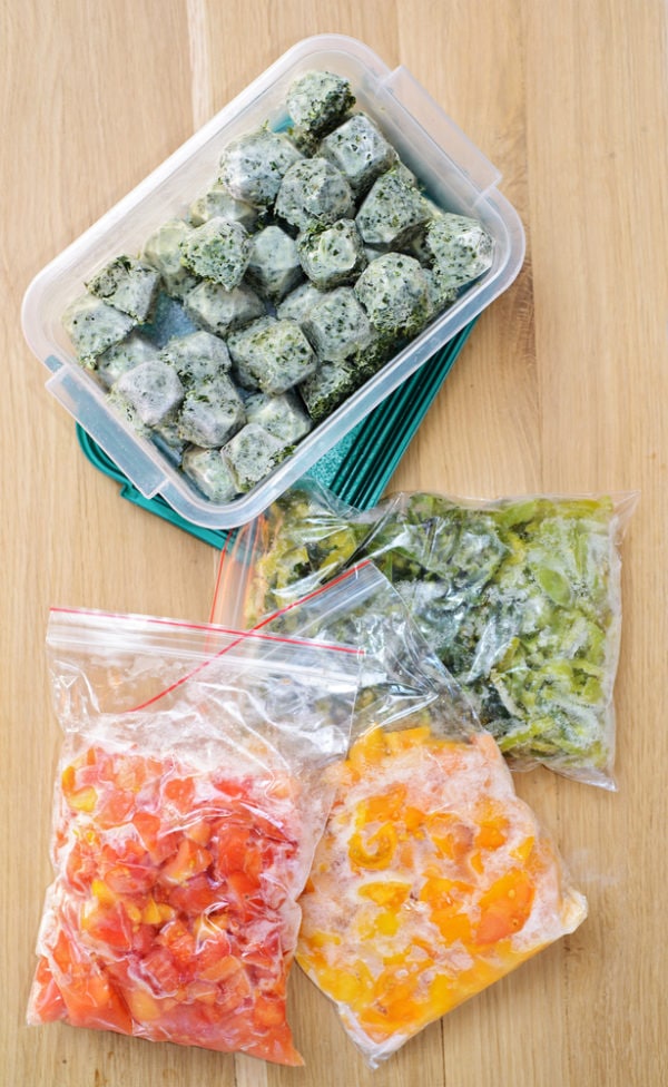 Freezer meals and prepped vegetables stored in bags.