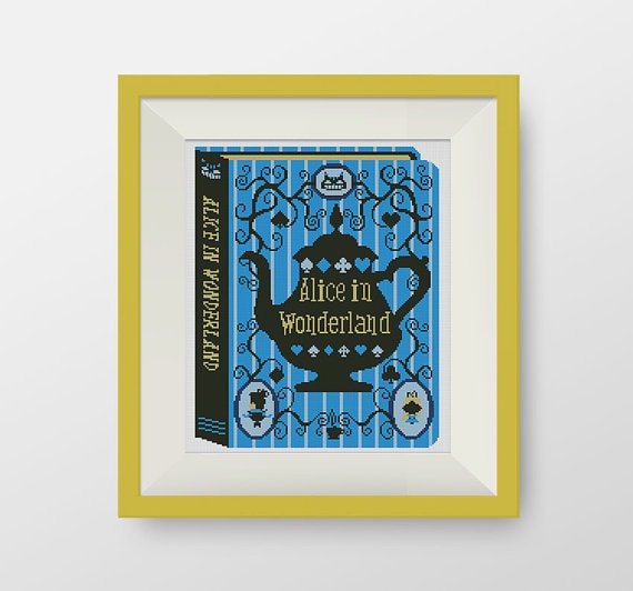 An Alice In Wonderland book needlepoint in a frame made as a homemade Christmas gift for mom.