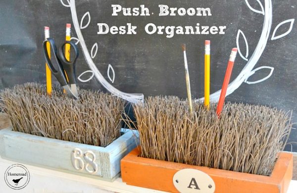 Two desk organizers are made from upturned push broom bristles set inside painted wood boxes.