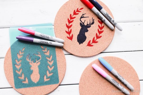 Custom coasters with a buck head and leaves drawn on cork coasters with Sharpie markers as a DIY gift for mom.