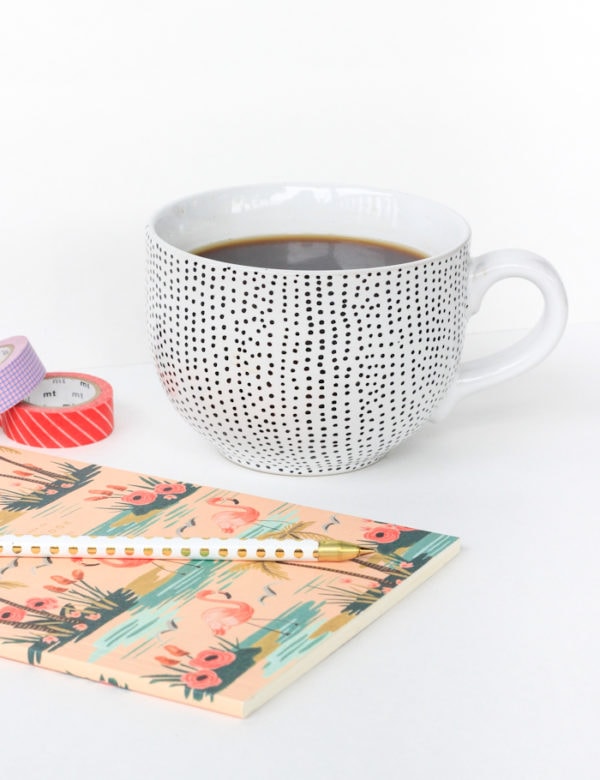 A handmade polka-dotted coffee mug made for mom paired with a special journal and gold polka-dotted pen.