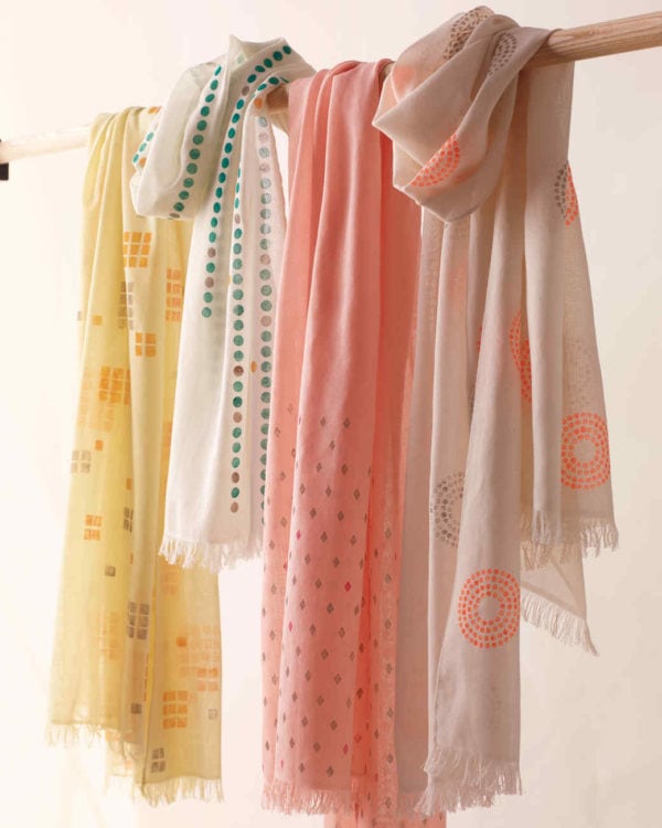 Four hand-painted scarves that have been made as a homemade gift for mom, aunt, and sisters.